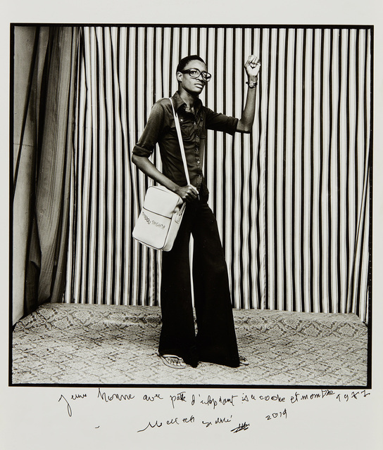 Malick Sidibé, ‘Jeune Homme, pattes d'elephant, avec sacoche et montre, 1977’, 2014, Phillips