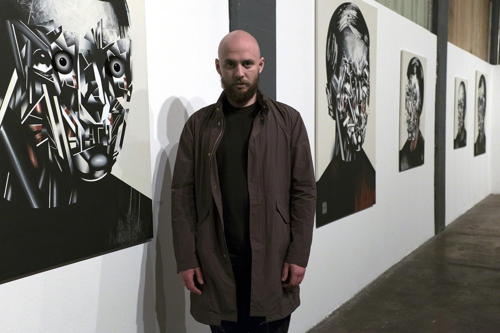 Artist Bohdan Burenko with his HEADS exhibition at Anno Domini. Artist Bohdan Burenko with his HEADS exhibition at Anno Domini.