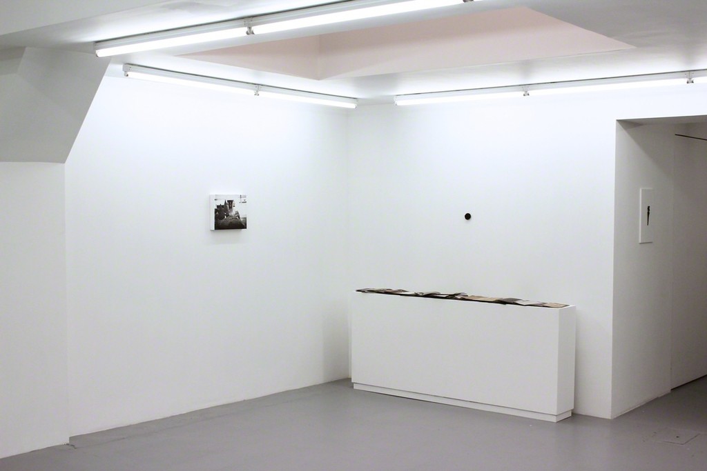 Installation view at Harlan Levey Projects "Kirtland", 2014, graphite, resin, funerary ash, on wood panel, 28 x 35.5 cm, "I want your Body", 2013, Bronze, 5.1 cm diameter and "Crackle & Drag Zine Set", 2013, 150 zines and plexi box, 19.5 x 16.2 x 15.2 cm. Installation view at Harlan Levey Projects "Kirtland", 2014, graphite, resin, funerary ash, on wood panel, 28 x 35.5 cm, "I want your Body", 2013, Bronze, 5.1 cm diameter and "Crackle & Drag Zine Set", 2013, 150 zines and plexi box, 19.5 x 16.2 x 15.2 cm.