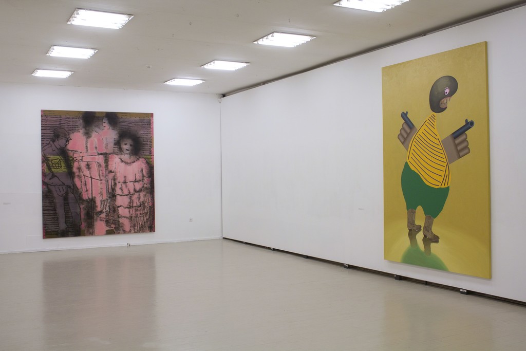 Fragment of exhibition "Družba". On the left: Jonas Gasiūnas, LITHUANIAN OPERA OR WOMAN, SMOKE AND BLIND MAN (2018, oil and charcoal from candle smoke on canvas, 285 x 240 cm).
On the right: Kaido Ole, "Armed Freak" (2014, oil, acrylic and alkyde paint with plastic details on canvas, 280 x 190 cm) Fragment of exhibition "Družba". On the left: Jonas Gasiūnas, LITHUANIAN OPERA OR WOMAN, SMOKE AND BLIND MAN (2018, oil and charcoal from candle smoke on canvas, 285 x 240 cm).
On the right: Kaido Ole, "Armed Freak" (2014, oil, acrylic and alkyde paint with plastic details on canvas, 280 x 190 cm)