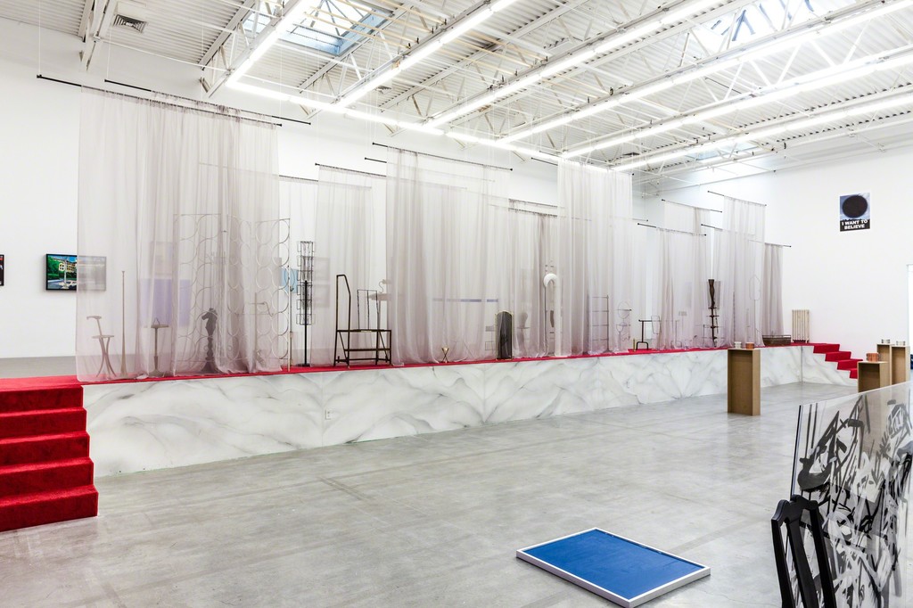 FADE IN: INT. ART GALLERY – DAY, installation view. FADE IN: INT. ART GALLERY – DAY, installation view.