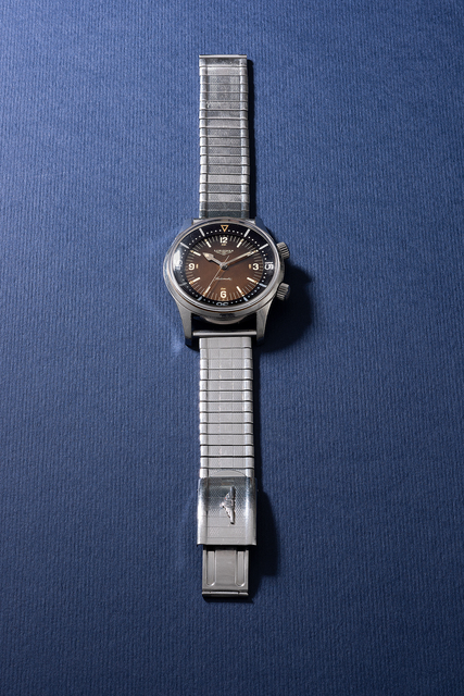 Longines, ‘A rare and attractive stainless steel diver’s wristwatch with bracelet, sweep center second, inner rotating bezel and tropical dial’, 1966, Phillips