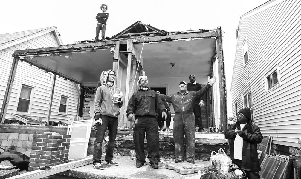 Ryan Mendoza and his crew in front of the house in Detroit Ryan Mendoza and his crew in front of the house in Detroit