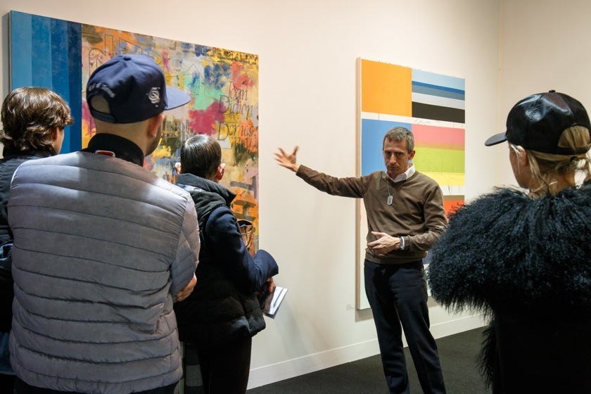 Gallery owner Theo Downes-Le Guin discussing Jack Featherly's work during a tour at VOLTA NY. Image courtesy David Willems Photography. Gallery owner Theo Downes-Le Guin discussing Jack Featherly's work during a tour at VOLTA NY. Image courtesy David Willems Photography.