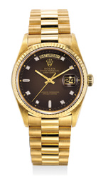 A very fine and rare yellow gold and diamond-set wristwatch day, date, sweep center seconds, bracelet, dégradé dial, guarantee and box