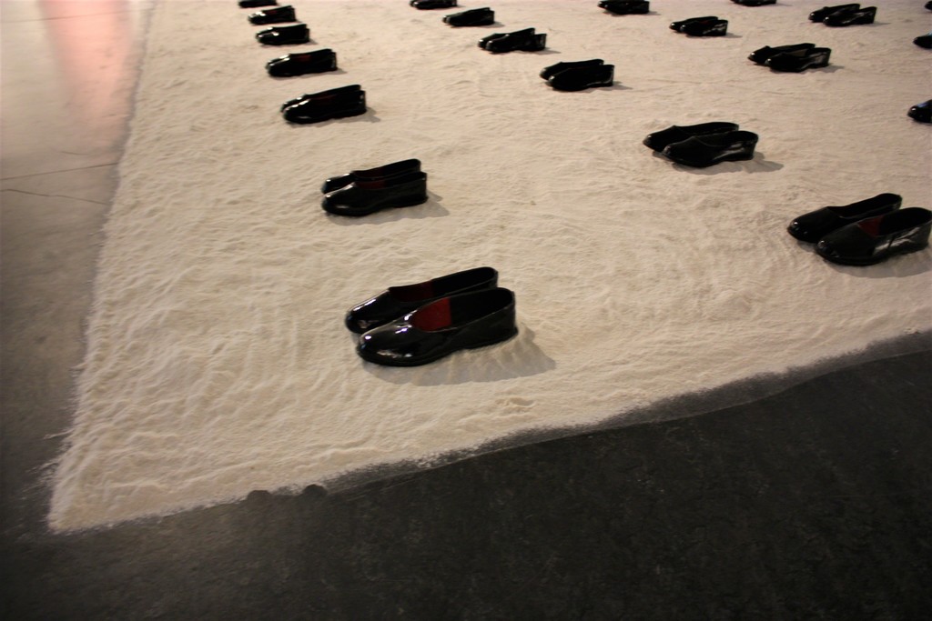 Fragment of the installation “Outgoing-Incoming” (Flour, lighting, footwear). Fragment of the installation “Outgoing-Incoming” (Flour, lighting, footwear).