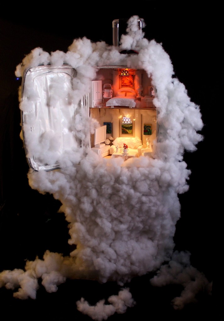 Cloudy Accommodation: In this work, the artist reflects her thoughts of what we carry with us when we leave our original homeland whether the reason of leaving is compulsory or optional. She questions what are the important things that we carry in our suitcase: Is it only our memories? Or our physical and moral world in which we lived in? Or is it the dream that we seek for? Cloudy Accommodation: In this work, the artist reflects her thoughts of what we carry with us when we leave our original homeland whether the reason of leaving is compulsory or optional. She questions what are the important things that we carry in our suitcase: Is it only our memories? Or our physical and moral world in which we lived in? Or is it the dream that we seek for?