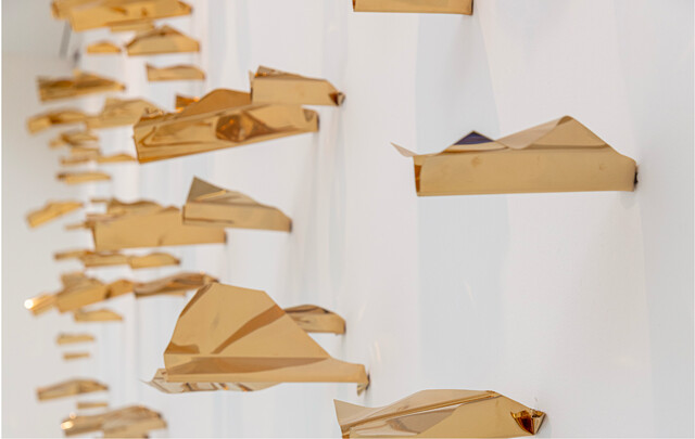 70 Paper Planes Simultaneously Hitting the Wall