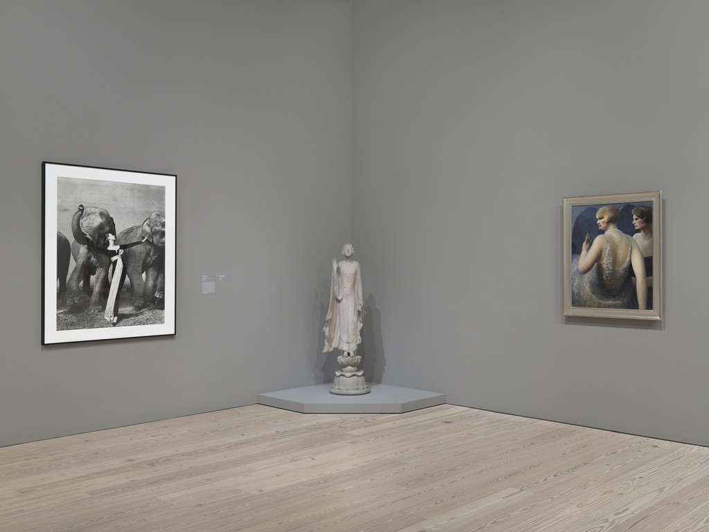 Installation view of “Human Interest: Portraits from the Whitney’s Collection” (April 27, 2016-Feb 12, 2017, Whitney Museum of American Art, N.Y.). From left to right: Richard Avedon, “Dovima with Elephants, Cirque d’Hiver, Paris”, 2001.187, Gertrude Vanderbilt Whitney, “Chinoise”, 31.79, Guy Pene Du Bois, “Woman with Cigarette”, 31.187 Installation view of “Human Interest: Portraits from the Whitney’s Collection” (April 27, 2016-Feb 12, 2017, Whitney Museum of American Art, N.Y.). From left to right: Richard Avedon, “Dovima with Elephants, Cirque d’Hiver, Paris”, 2001.187, Gertrude Vanderbilt Whitney, “Chinoise”, 31.79, Guy Pene Du Bois, “Woman with Cigarette”, 31.187