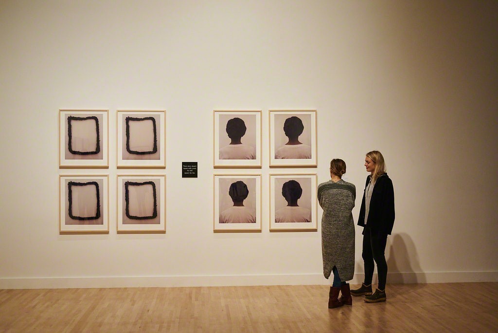 Guests discussing Lorna Simpson's 1990 work "Square Deal" at the Fall 2017 Open House.
Photo credit: Jonathan Vanderweit. Guests discussing Lorna Simpson's 1990 work "Square Deal" at the Fall 2017 Open House.
Photo credit: Jonathan Vanderweit.