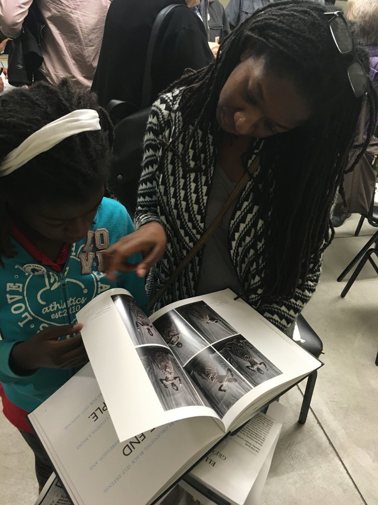 Mother and daughter reviewing All Power, Seattle, WA, 2016 Mother and daughter reviewing All Power, Seattle, WA, 2016