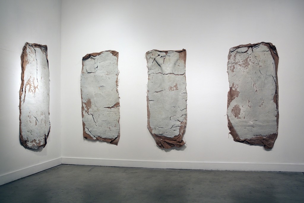 Erika Ostrander, "Compression (Blue Book)", 2016, pulped blue books, salt, burlap, racoon tracks Erika Ostrander, "Compression (Blue Book)", 2016, pulped blue books, salt, burlap, racoon tracks