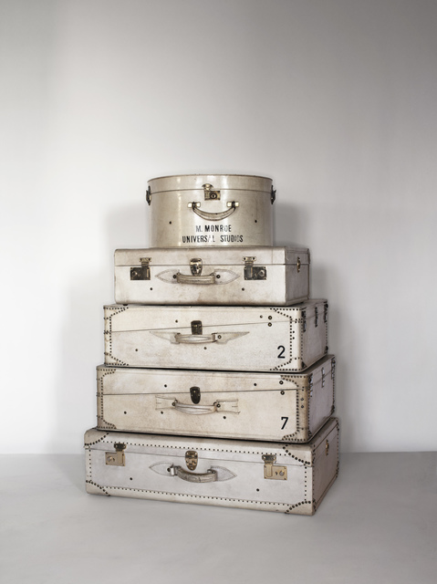 stack of Goyard traveling trunks at 