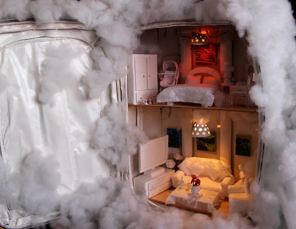Cloudy Accommodation: In this work, the artist reflects her thoughts of what we carry with us when we leave our original homeland whether the reason of leaving is compulsory or optional. She questions what are the important things that we carry in our suitcase: Is it only our memories? Or our physical and moral world in which we lived in? Or is it the dream that we seek for? (Detail image) Cloudy Accommodation: In this work, the artist reflects her thoughts of what we carry with us when we leave our original homeland whether the reason of leaving is compulsory or optional. She questions what are the important things that we carry in our suitcase: Is it only our memories? Or our physical and moral world in which we lived in? Or is it the dream that we seek for? (Detail image)