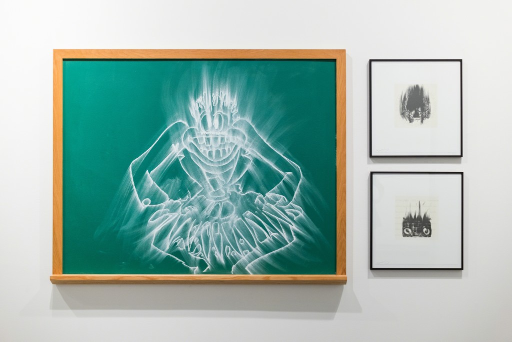 Drawing and lithographs by Gary Simmons. Chalkboard drawing from the collection of John Goodwin and Michael-Jay Robinson. Lithographs shown courtesy Tamarind Institute. Drawing and lithographs by Gary Simmons. Chalkboard drawing from the collection of John Goodwin and Michael-Jay Robinson. Lithographs shown courtesy Tamarind Institute.
