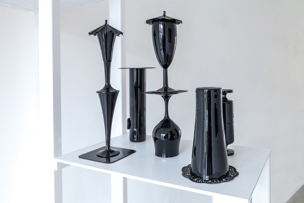 exhibition view: „Traurige Trinker“ (engl. Sad Drinkers), 2015 | glasses (10 pieces), varnish, beer mat, coaster, cocktail umbrella (right), Christine de la Garenne | image: ©dasesszimmer exhibition view: „Traurige Trinker“ (engl. Sad Drinkers), 2015 | glasses (10 pieces), varnish, beer mat, coaster, cocktail umbrella (right), Christine de la Garenne | image: ©dasesszimmer