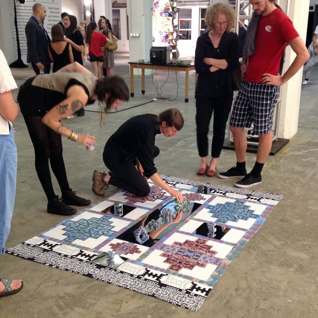 An installation by Brenna Murphy (shown here rearranging a 3D-printed sculpture) at the Living Computer Museum for a satellite exhibition curated by organizers for the Seattle Art Fair. An installation by Brenna Murphy (shown here rearranging a 3D-printed sculpture) at the Living Computer Museum for a satellite exhibition curated by organizers for the Seattle Art Fair.
