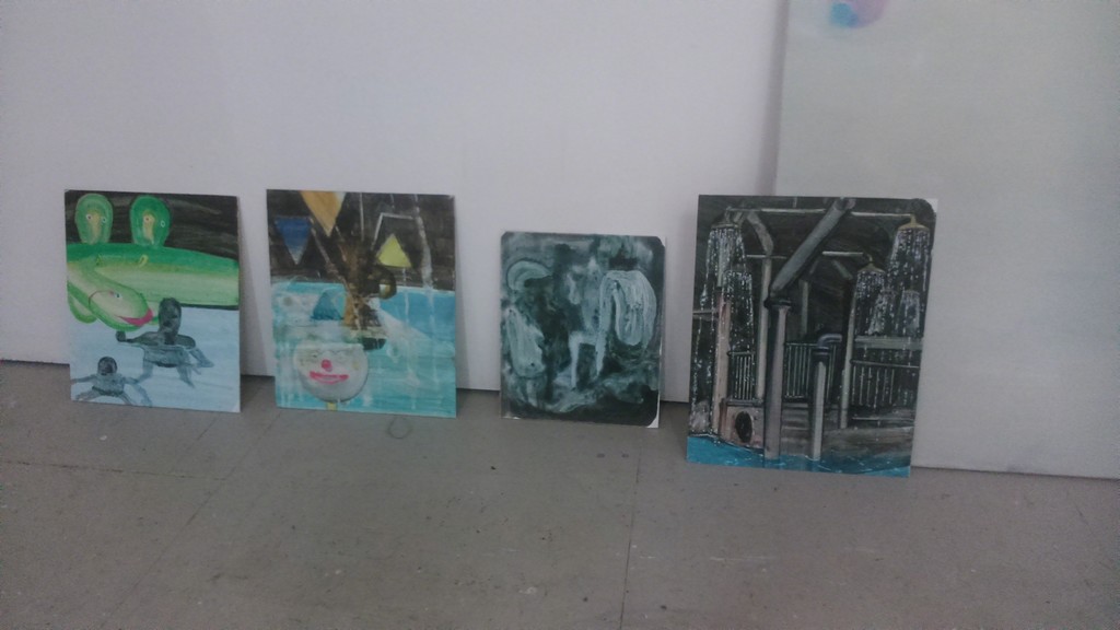 Various paintings on display in the artist's studio. Various paintings on display in the artist's studio.