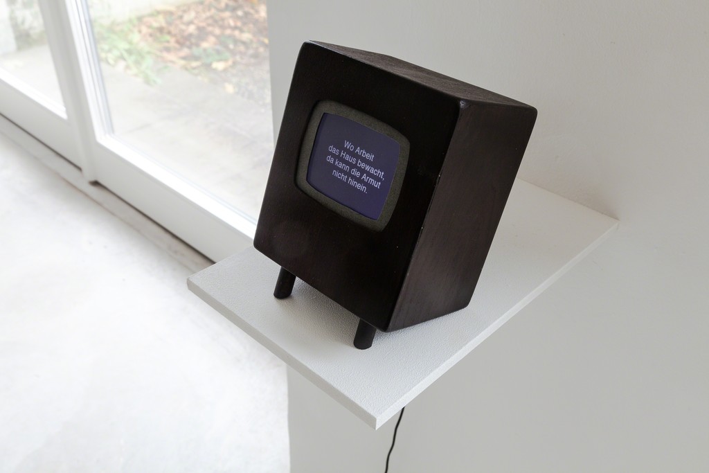 exhibition view: „There is no place like home“, 2012 | wooden object, digital frame with text animation, 16, 5 x 12 x 9,5cm | image: marianne halter exhibition view: „There is no place like home“, 2012 | wooden object, digital frame with text animation, 16, 5 x 12 x 9,5cm | image: marianne halter