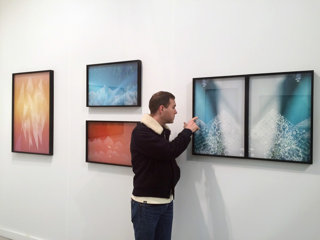 Artist Christopher Russell with works on view during AIPAD. Artist Christopher Russell with works on view during AIPAD.