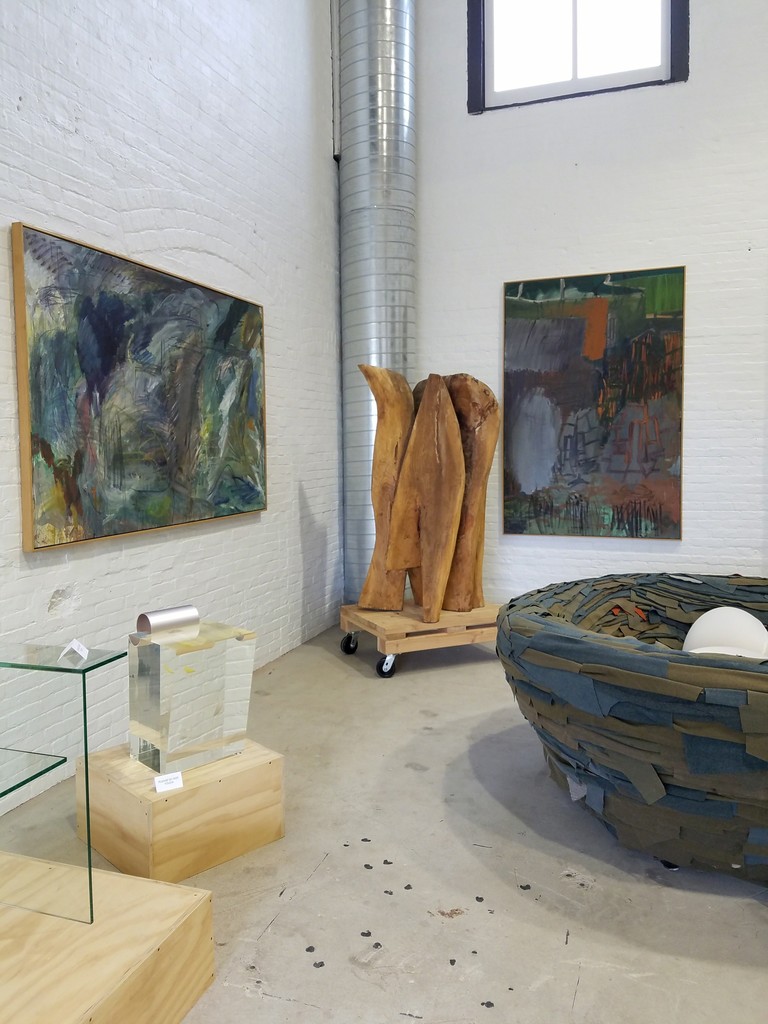 Paintings by Per Kirkeby. Walnut sculpture by Raoul Hague. Paintings by Per Kirkeby. Walnut sculpture by Raoul Hague.