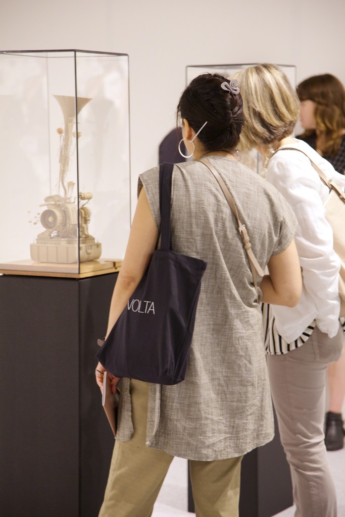 VOLTA guests react to Daniel Agdag’s automated cardboard machines, a solo presentation Sample of no value presented by MARS Gallery, Melbourne. Courtesy Nicholas Winter Photography. VOLTA guests react to Daniel Agdag’s automated cardboard machines, a solo presentation Sample of no value presented by MARS Gallery, Melbourne. Courtesy Nicholas Winter Photography.