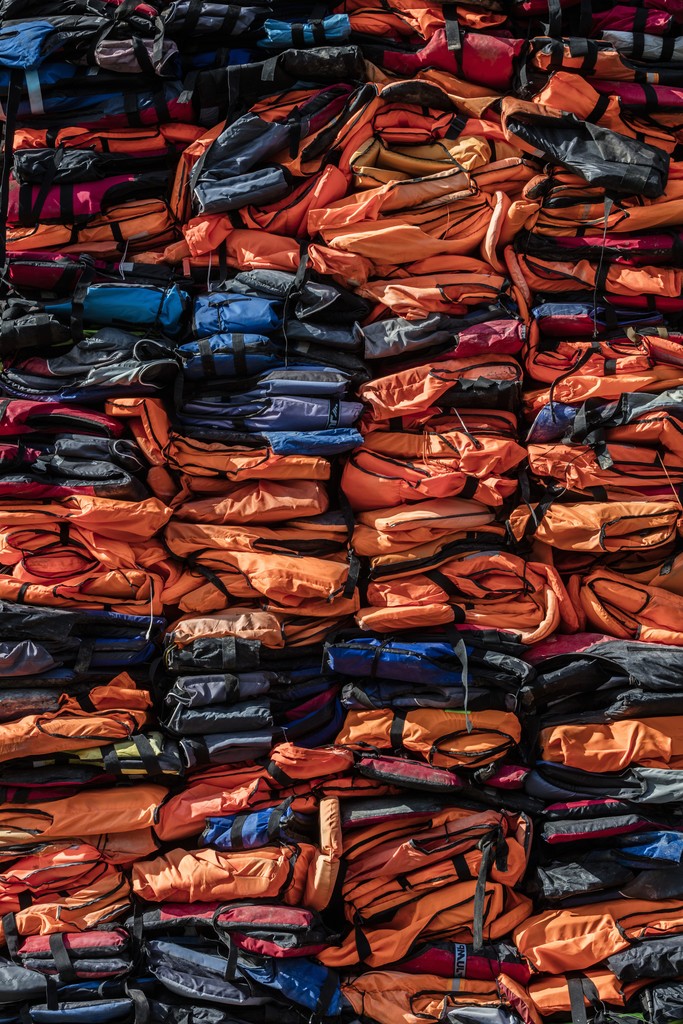 Ai Weiwei, "Soleil Levant", 2017. Detail, Kunsthal Charlottenborg, 2017. Life jackets in front of windows of facade. Courtesy of the artist. Photo by Anders Sune Berg. Ai Weiwei, "Soleil Levant", 2017. Detail, Kunsthal Charlottenborg, 2017. Life jackets in front of windows of facade. Courtesy of the artist. Photo by Anders Sune Berg.