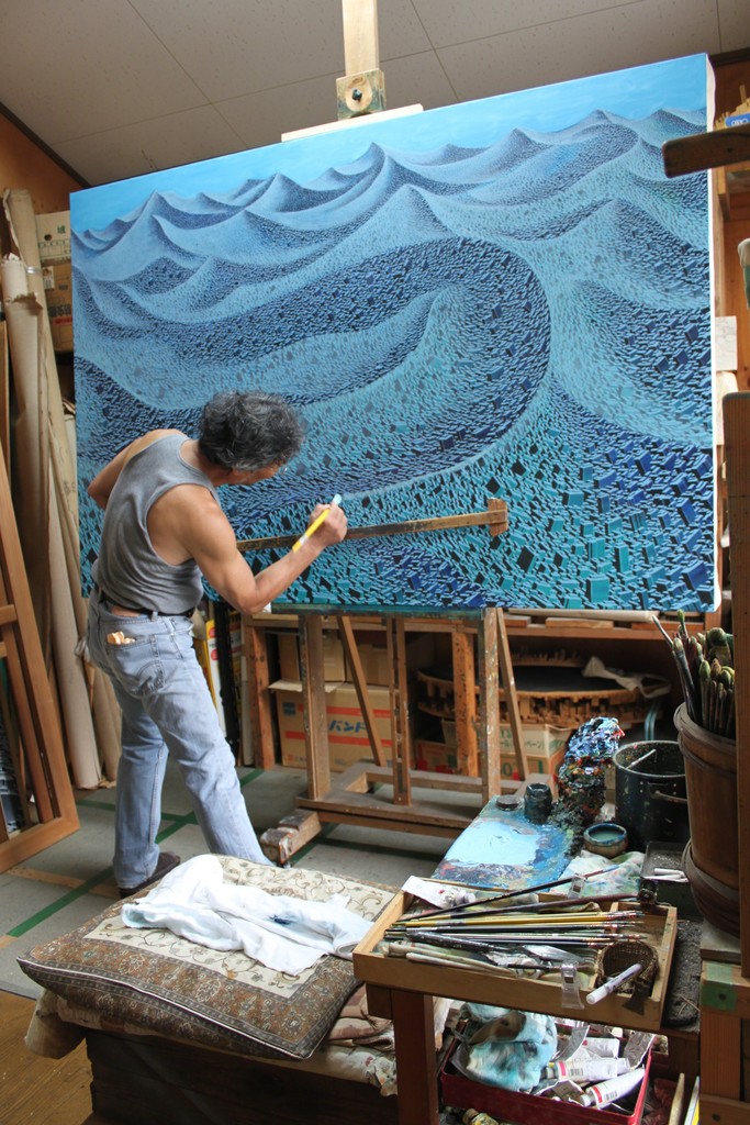Satoshi Koyama working in his studio Satoshi Koyama working in his studio