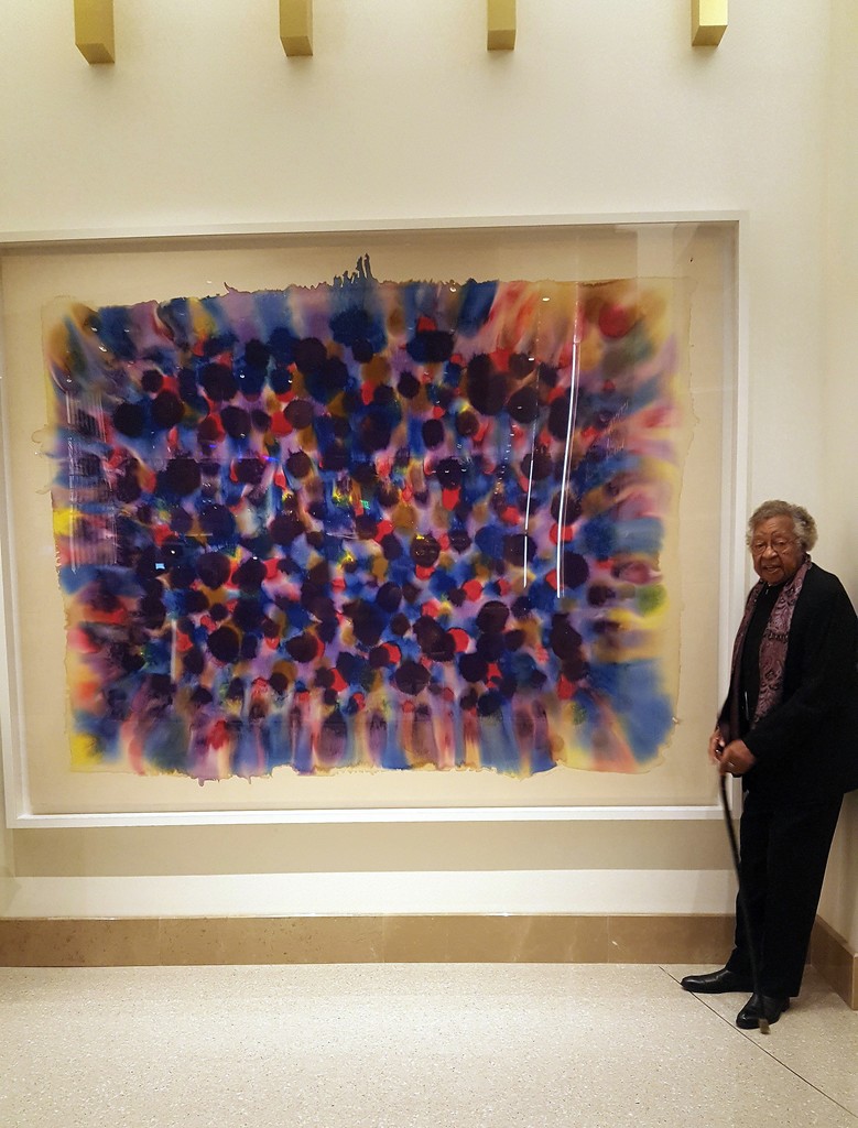 Kenneth Victor Young with his work, "Spring Rain" (1970) installed as part of a permanent collection at the MGM Grand, National Harbor, Maryland. Photo from 2016. Kenneth Victor Young with his work, "Spring Rain" (1970) installed as part of a permanent collection at the MGM Grand, National Harbor, Maryland. Photo from 2016.