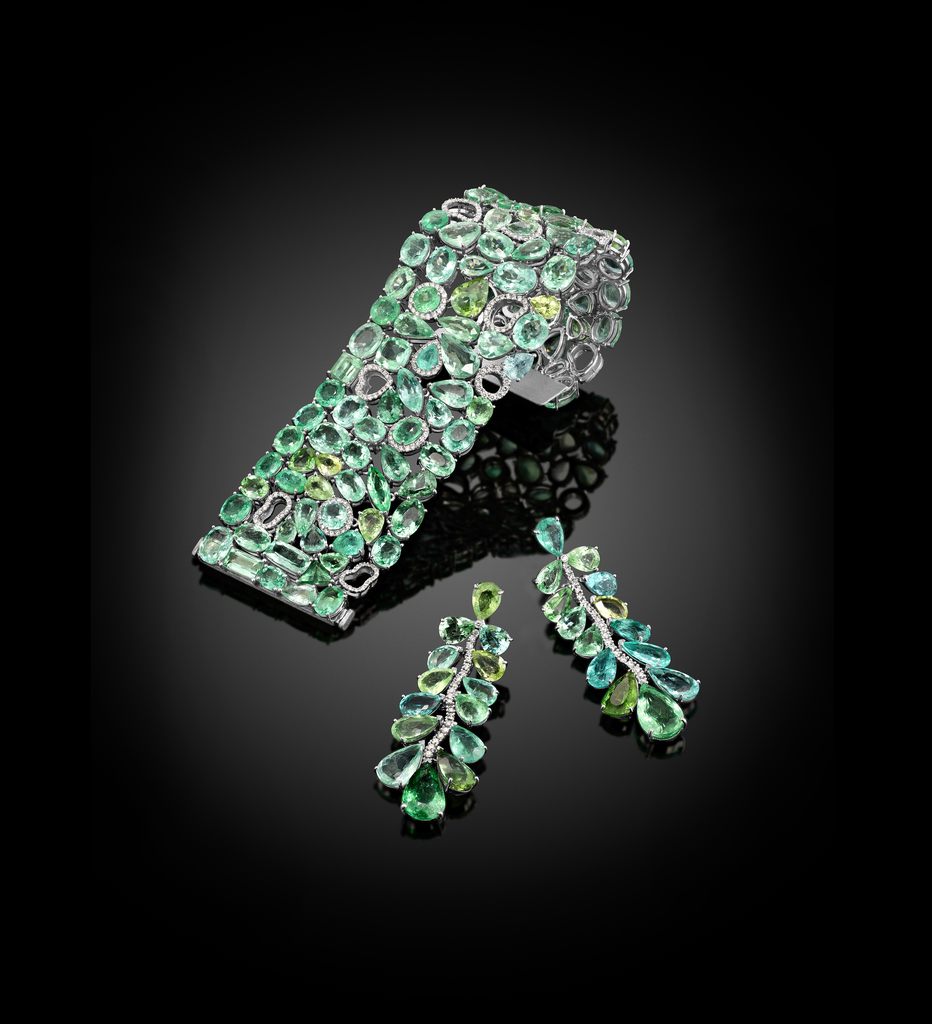 Multi-color Paraiba tourmalines enhanced by natural white diamonds. Multi-color Paraiba tourmalines enhanced by natural white diamonds.