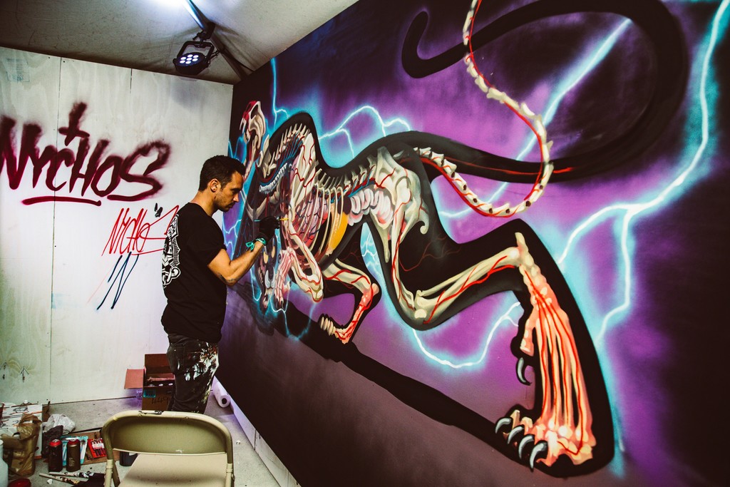 Nychos live painting "Dissection of Black Panther". Limited edition prints will be released after the festival. Nychos live painting "Dissection of Black Panther". Limited edition prints will be released after the festival.