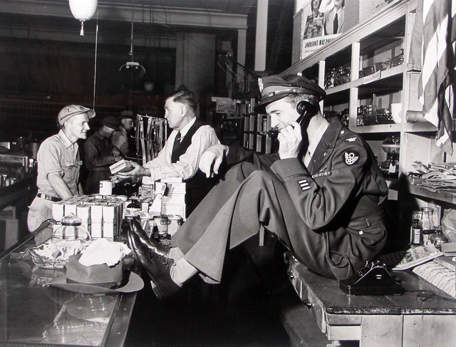 Peter Stackpole, ‘Jimmy Stewart Talking Behind Counter at His Father's Hardware Store While His Father Chats with Customer upon Stewar's Return from WWII, Indiana, PA’, 1947, Contessa Gallery