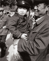 Man Holding Young Boy