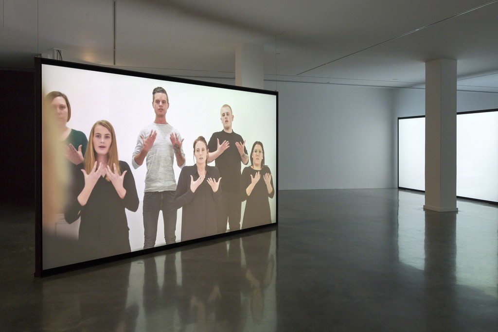 Angelica Mesiti, The Colour of Saying (still, detail), 2015, installation view, Telling Tales: Excursions in Narrative Form, Museum of Contemporary Art Australia, 2016, 3-channel high definition digital video, colour, sound, duration: 25 minutes, The performance was originated in collaboration with and produced by Lilith Performance Studio, Malmö, Sweden 2015, image courtesy the artist and Museum of Contemporary Art Australia © the artist, photograph: Jessica Maurer Angelica Mesiti, The Colour of Saying (still, detail), 2015, installation view, Telling Tales: Excursions in Narrative Form, Museum of Contemporary Art Australia, 2016, 3-channel high definition digital video, colour, sound, duration: 25 minutes, The performance was originated in collaboration with and produced by Lilith Performance Studio, Malmö, Sweden 2015, image courtesy the artist and Museum of Contemporary Art Australia © the artist, photograph: Jessica Maurer