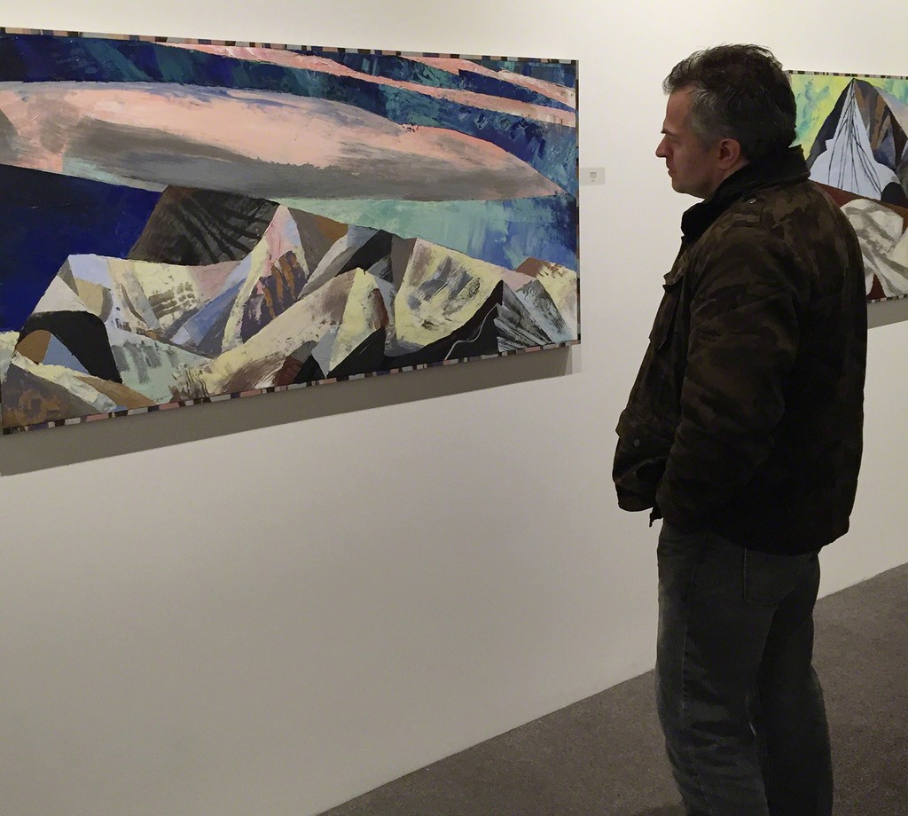 An unidentified man inspects Lucinda Parker's painting, "Orogeny" An unidentified man inspects Lucinda Parker's painting, "Orogeny"